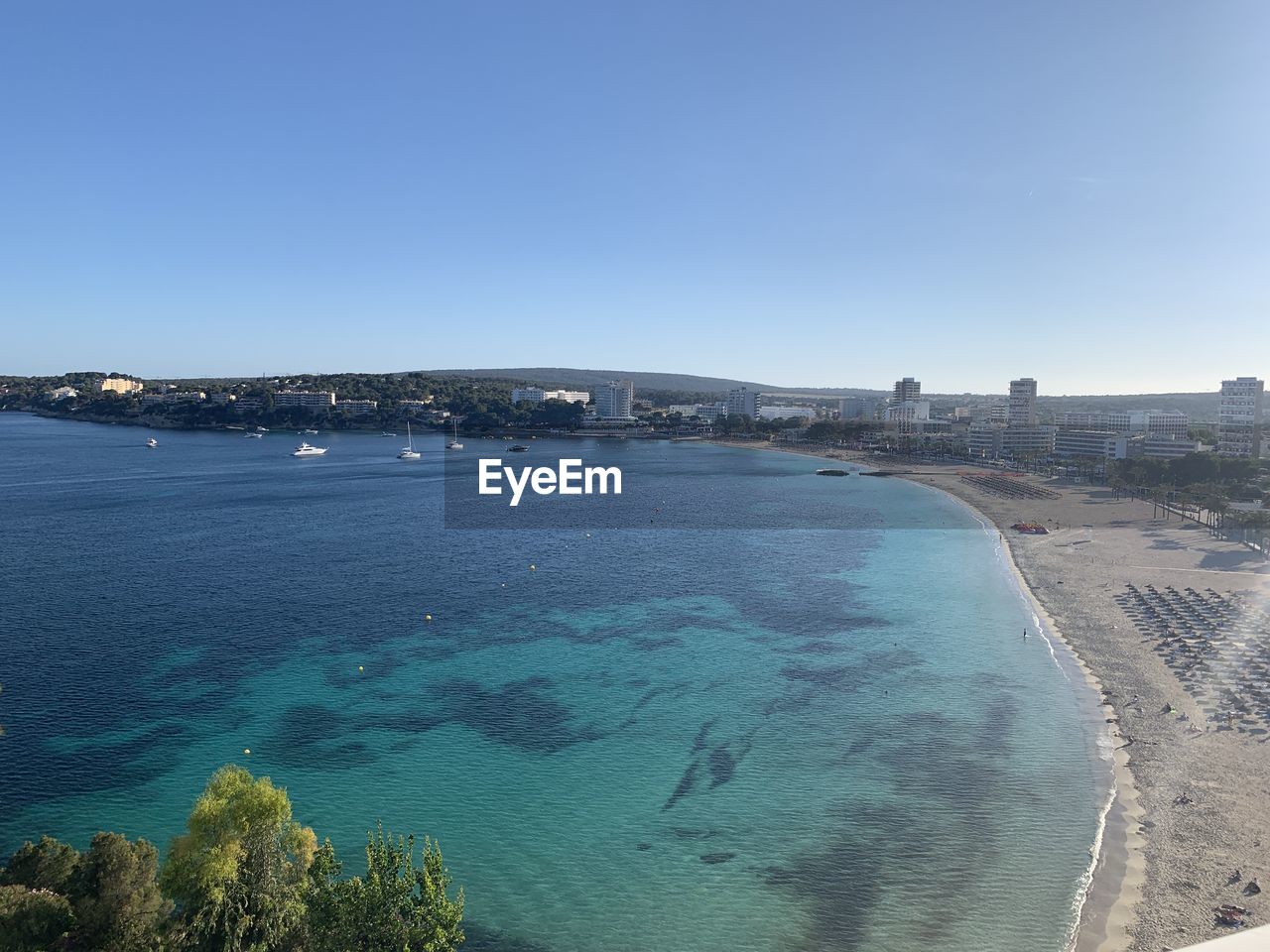 Scenic view of sea against clear blue sky