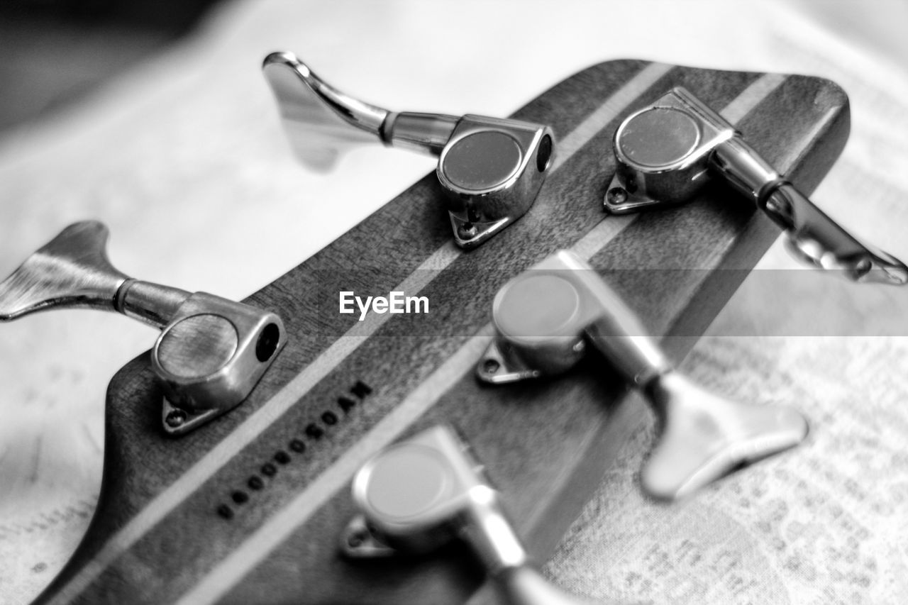 Cropped image of guitar on table