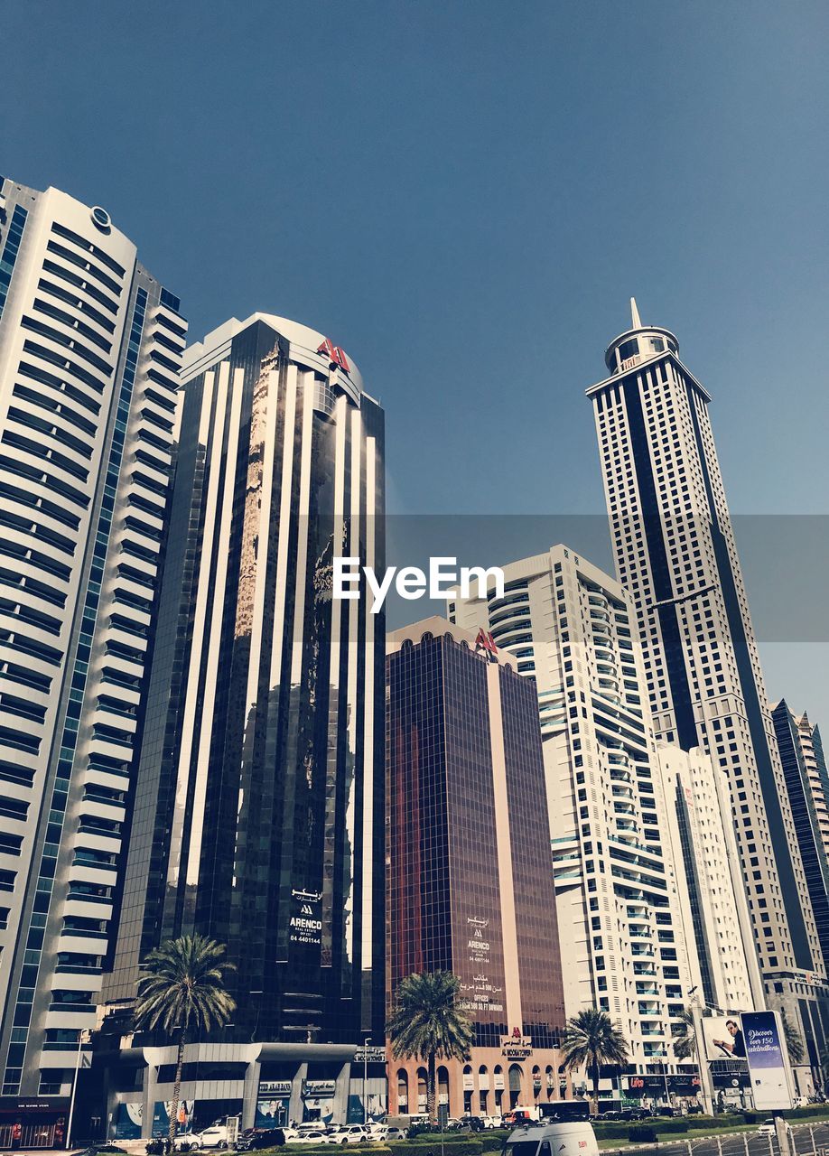 LOW ANGLE VIEW OF MODERN BUILDINGS AGAINST SKY