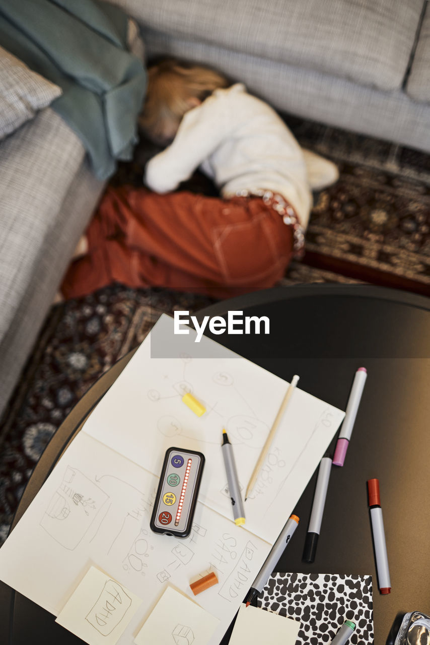 Girl during occupational therapy lying on floor