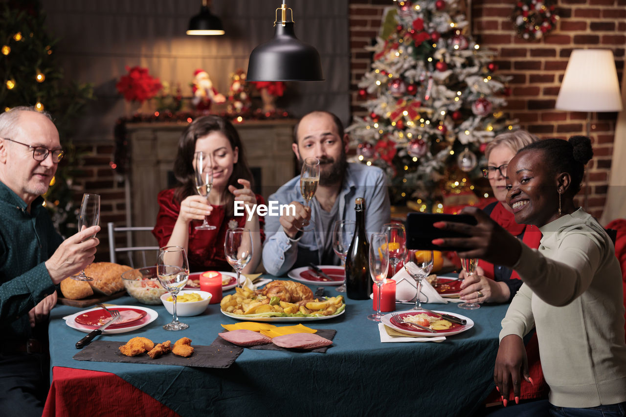 rear view of woman having food at home