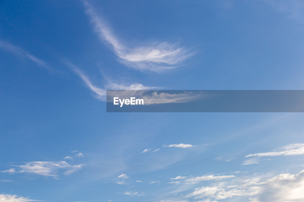 sky, cloud, blue, beauty in nature, daytime, nature, no people, sunlight, scenics - nature, cloudscape, low angle view, horizon, tranquility, backgrounds, environment, day, outdoors, idyllic, white, tranquil scene, wind, atmosphere, dramatic sky, copy space, fluffy