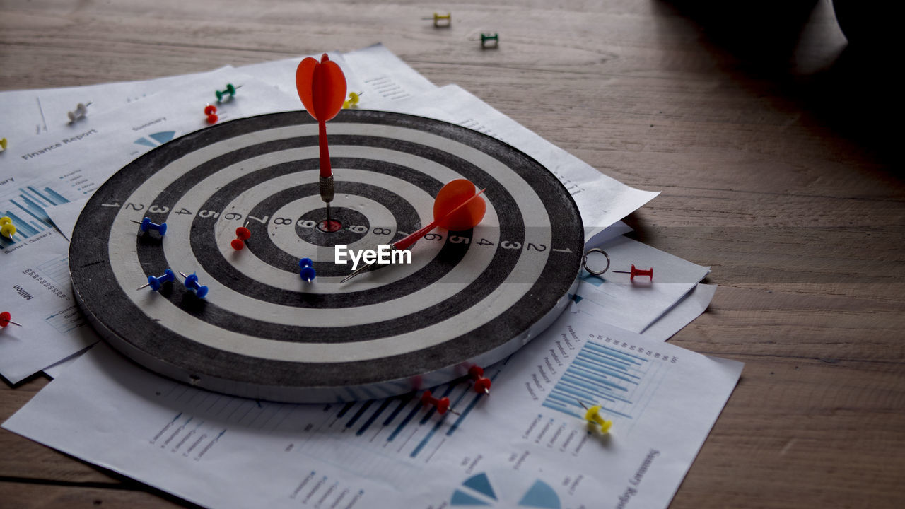 High angle view of dartboard on table