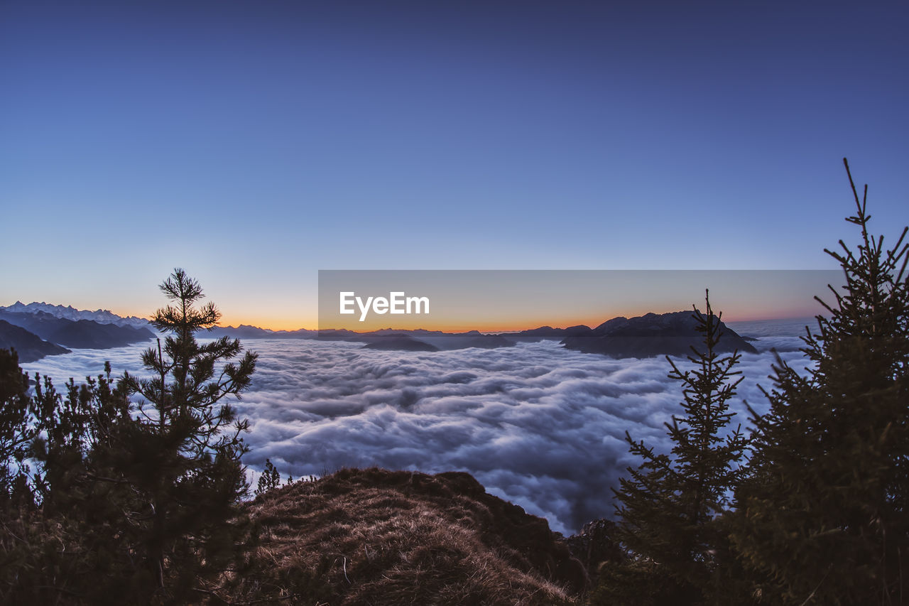 SCENIC VIEW OF SNOWCAPPED MOUNTAIN AGAINST SKY DURING WINTER