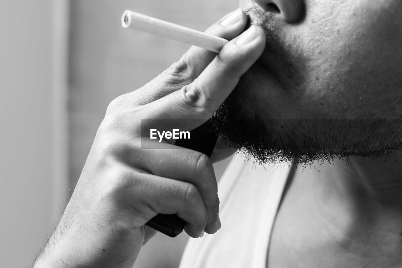 Close-up of man smoking cigarette