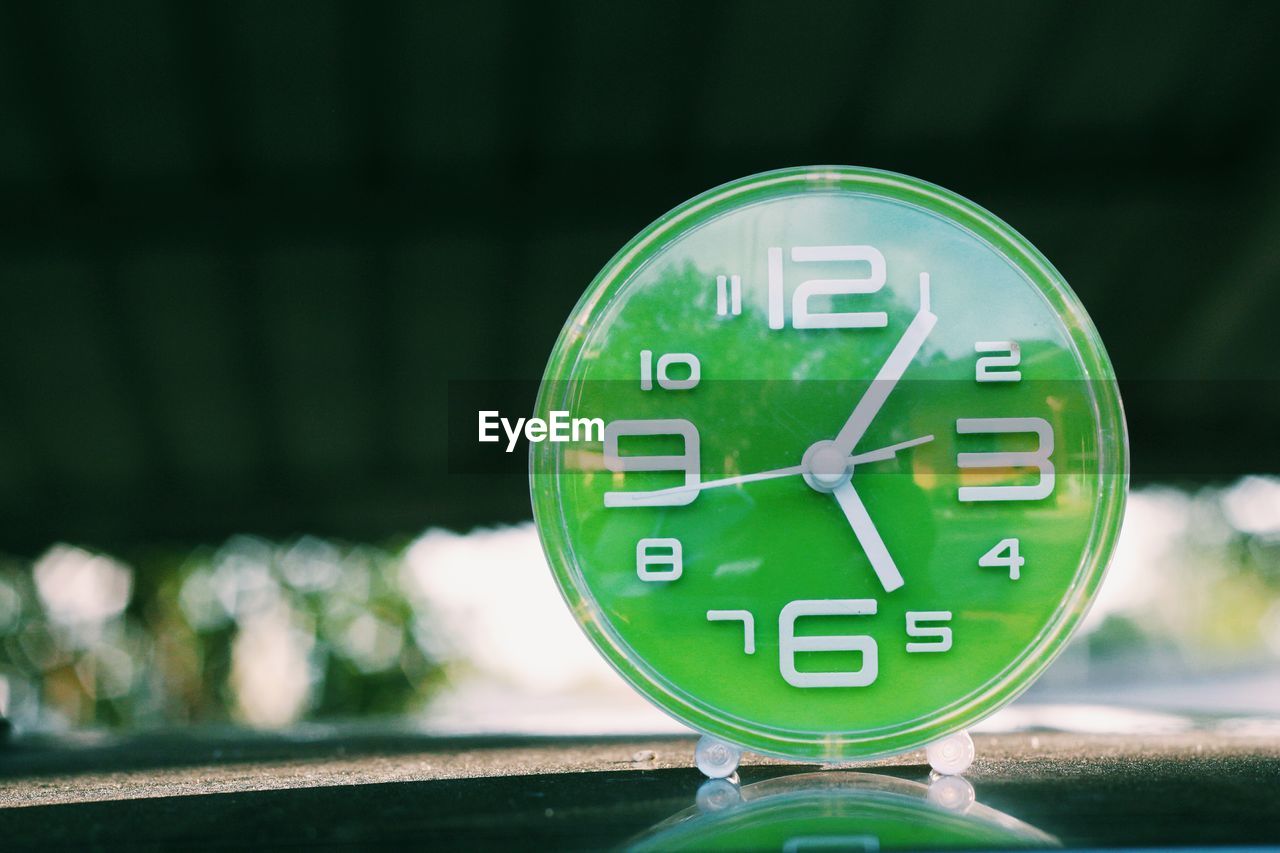 Close-up of green clock