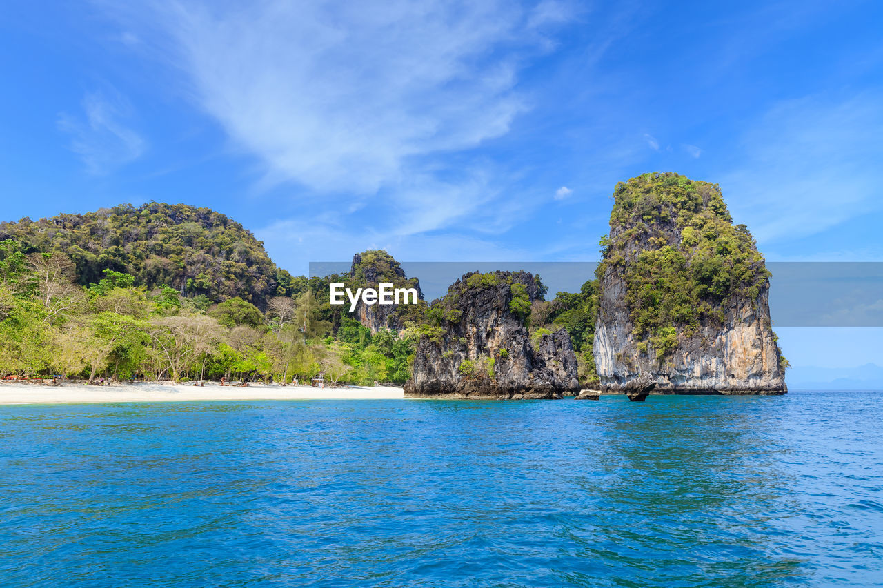 ROCK FORMATIONS IN SEA AGAINST SKY
