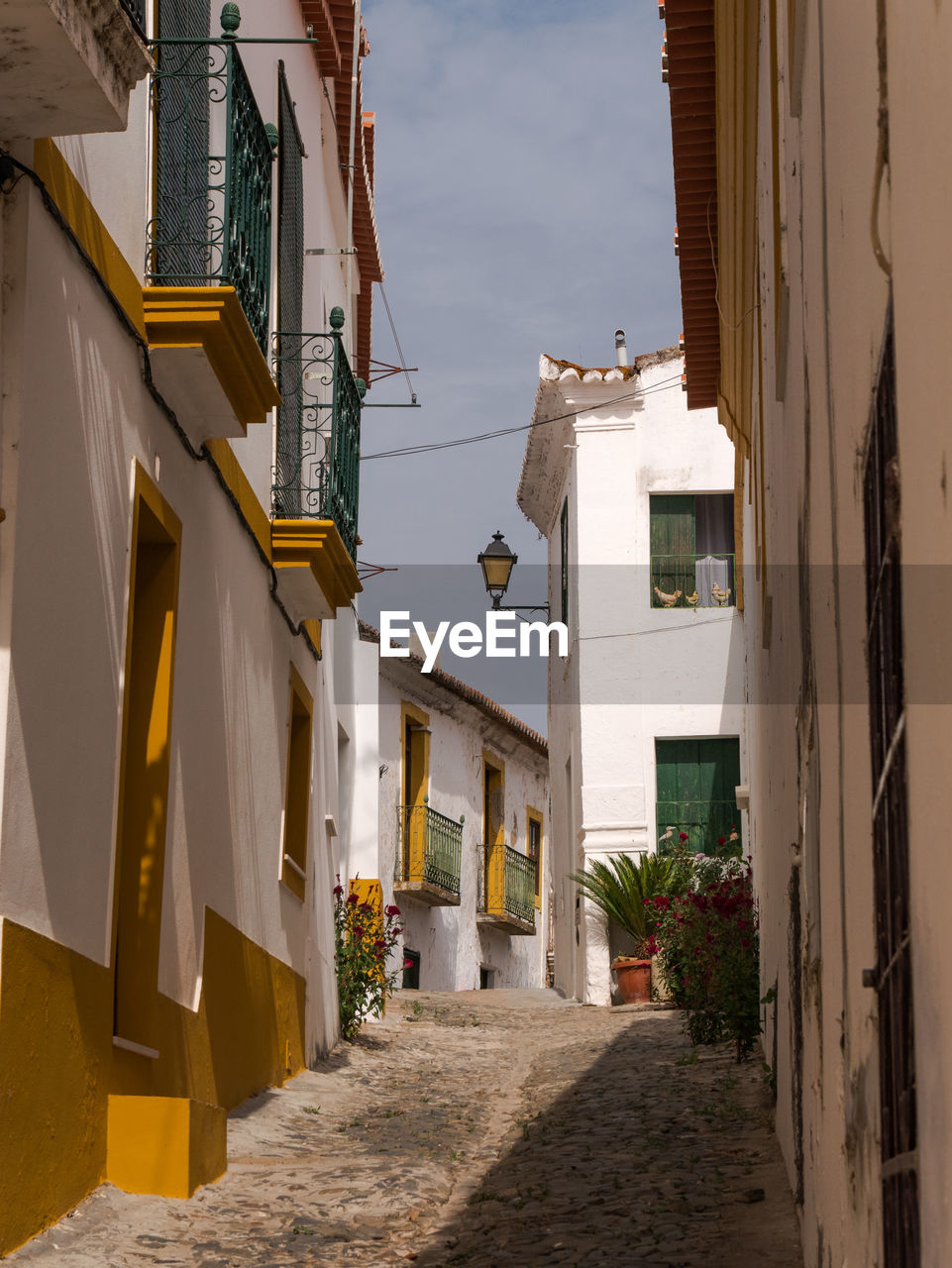 STREET AMIDST BUILDINGS IN TOWN