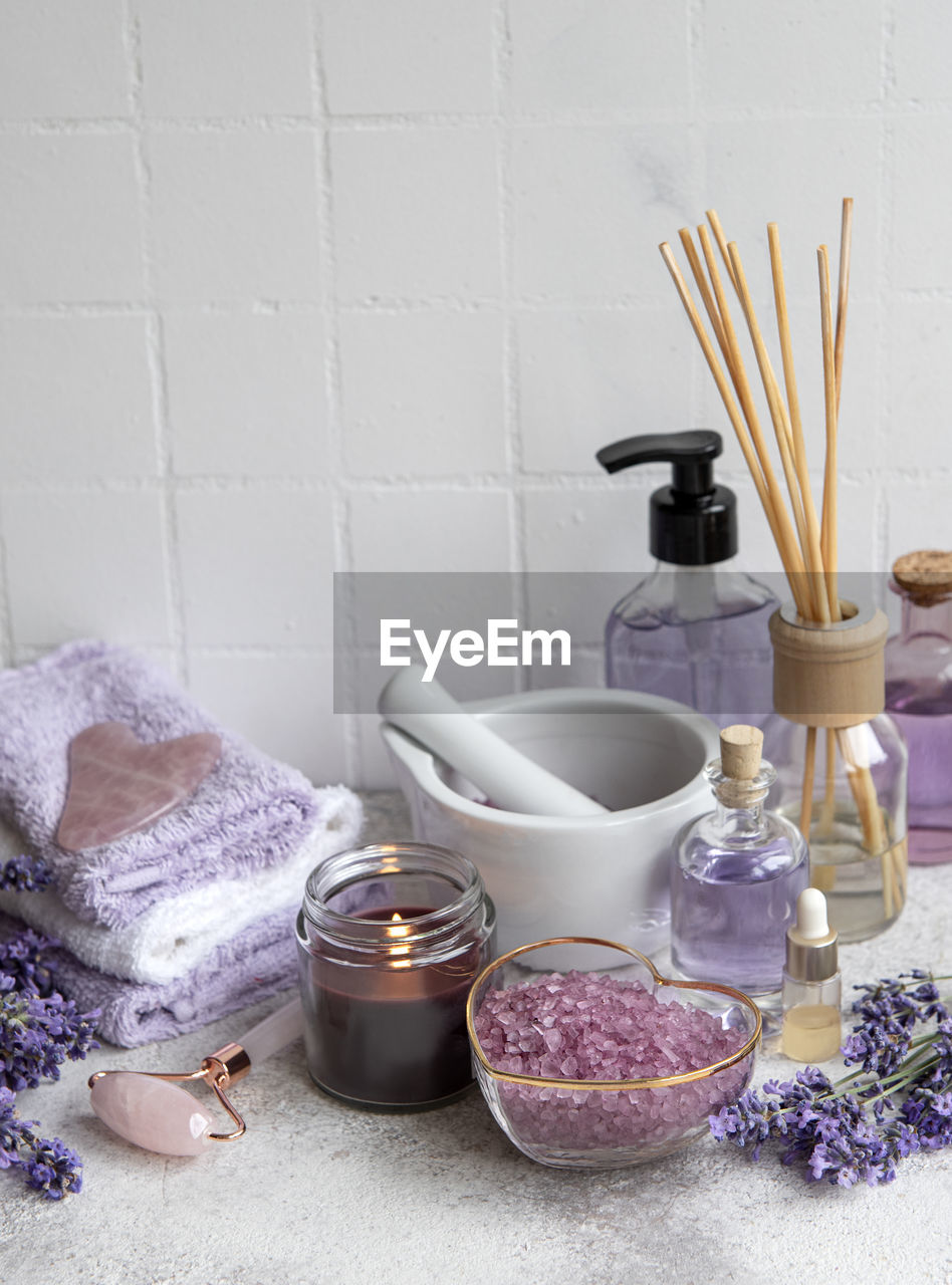 Lavender spa. essential oils, sea salt, towels and face roller. 