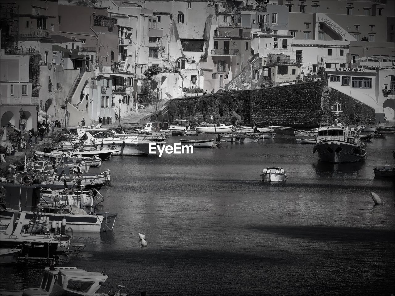 Scenic view of river by buildings in city
