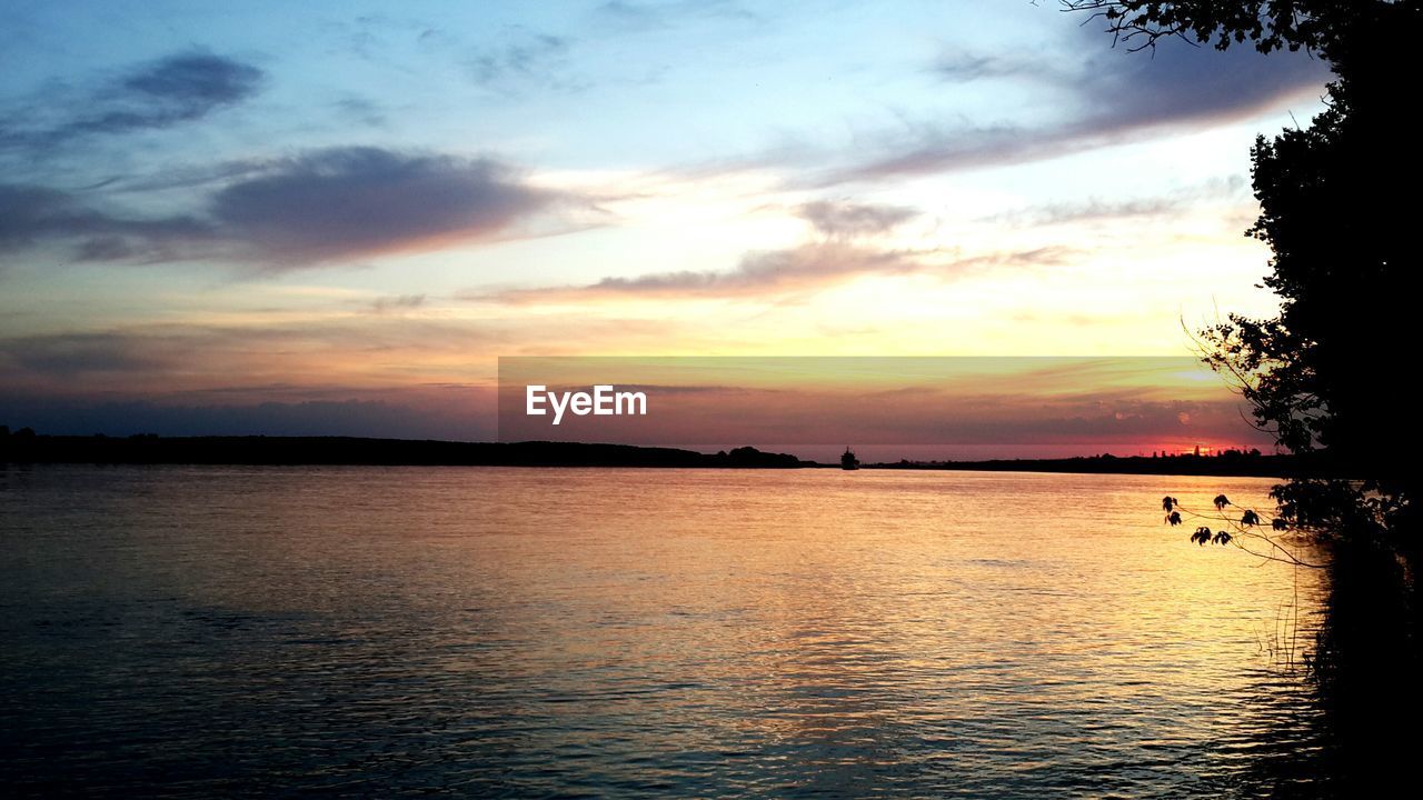 SCENIC VIEW OF SEA DURING SUNSET