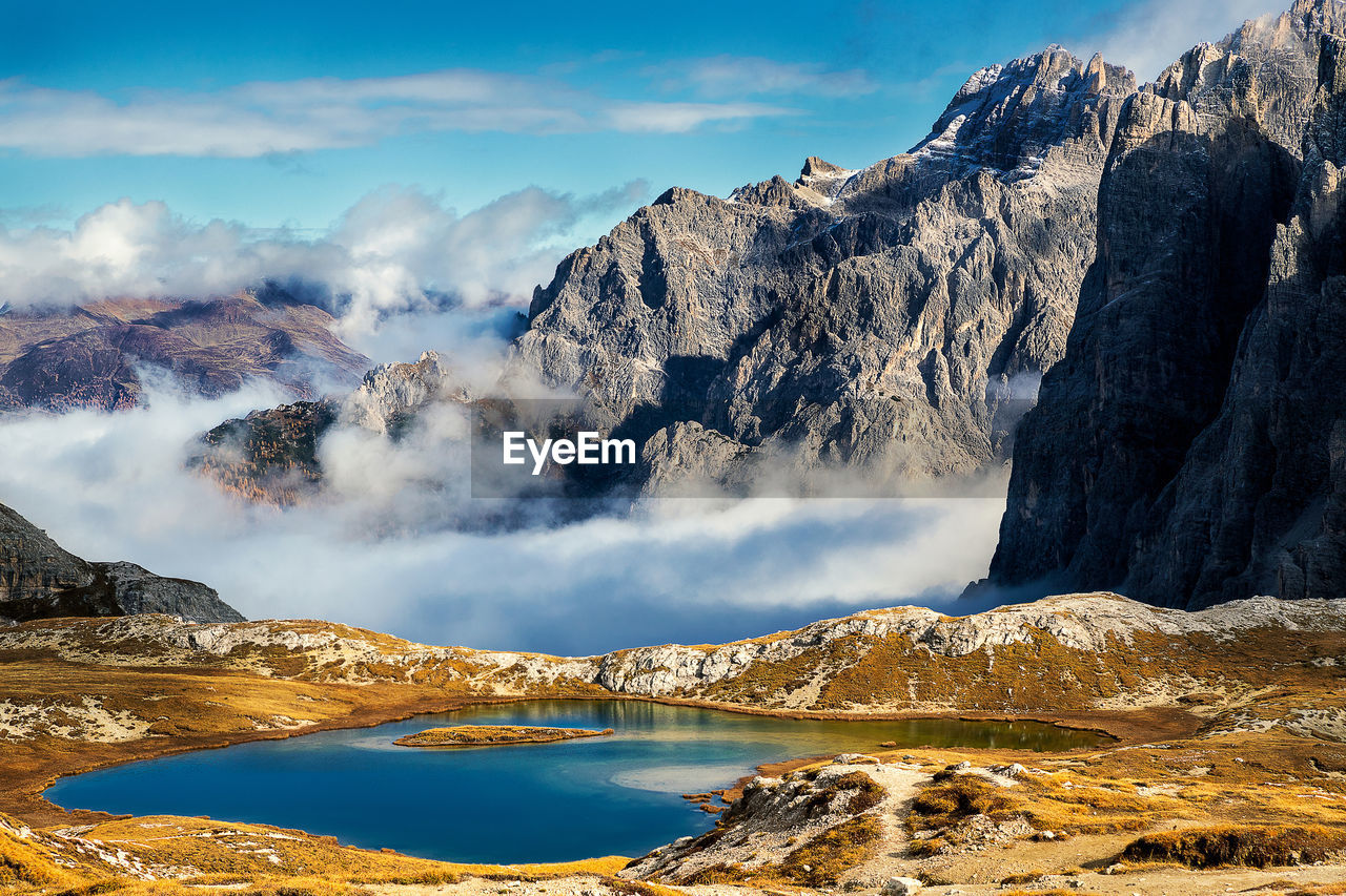 PANORAMIC VIEW OF SNOWCAPPED MOUNTAINS AGAINST SKY