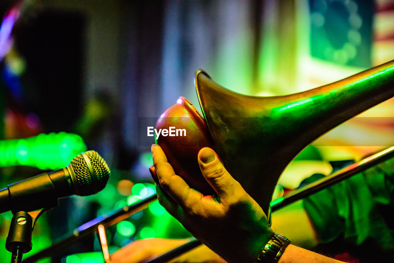 Close-up of human hand touching musical instrument