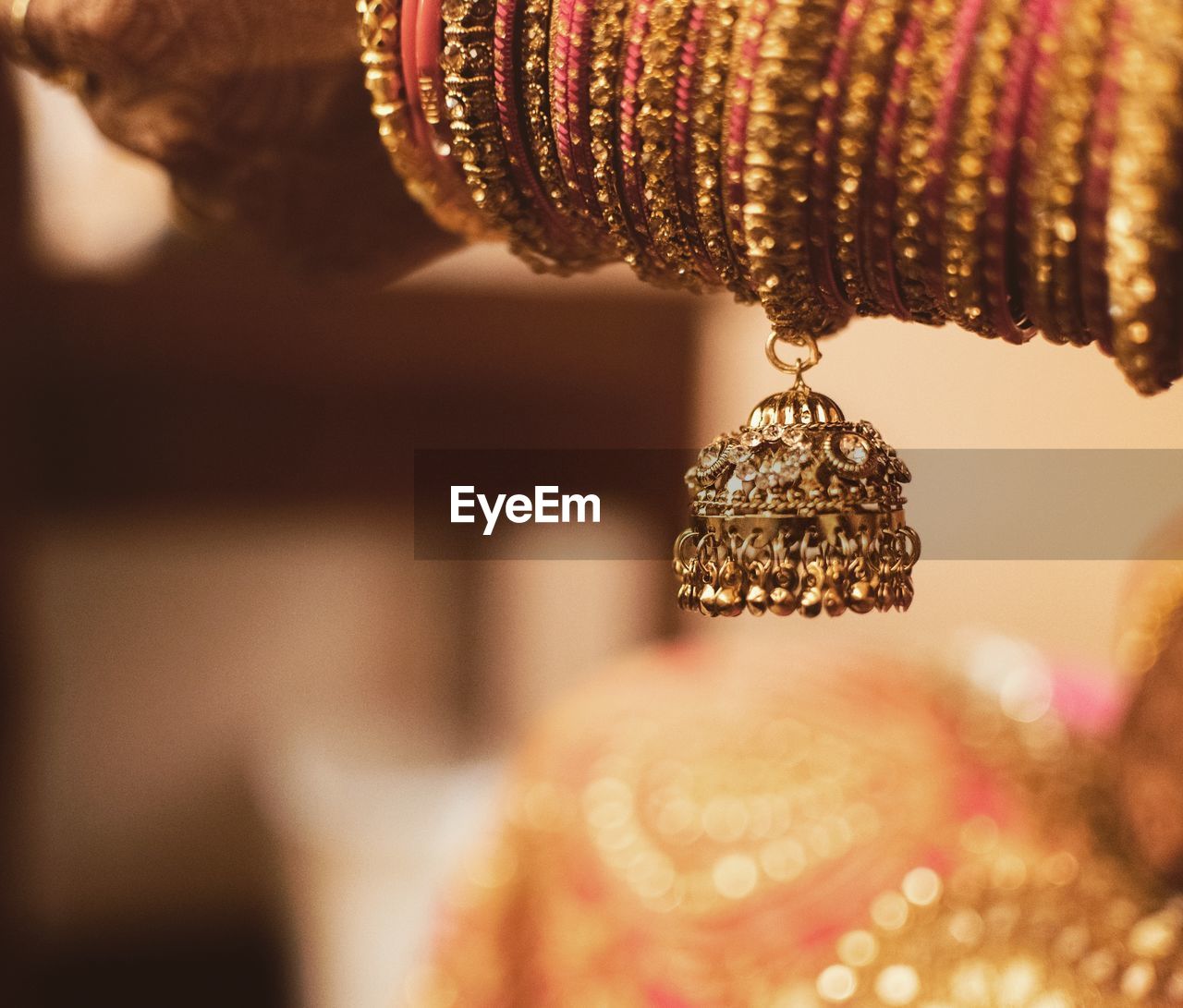 Cropped hand of woman wearing bangles