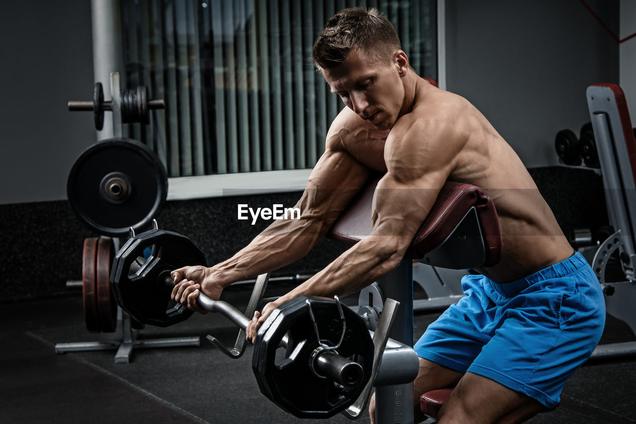 low section of man exercising in gym