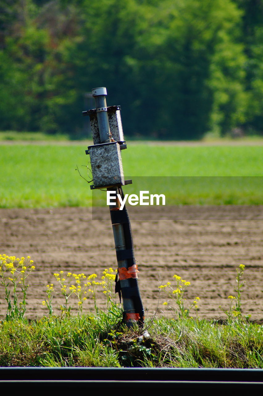 CLOSE-UP OF BASKETBALL HOOP IN FIELD