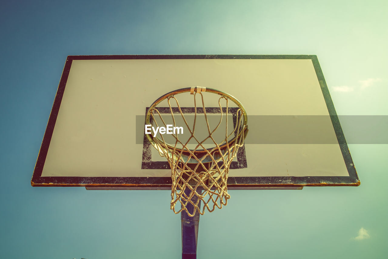 Low angle view of basketball hoop against sky