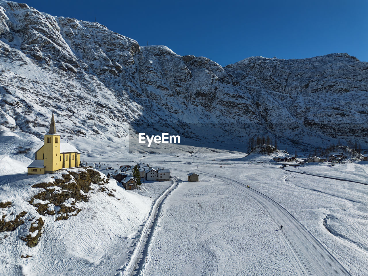 scenic view of snow covered mountains against sky