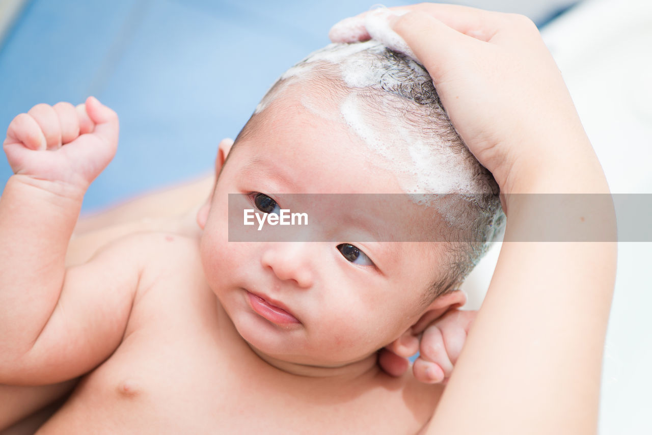 CLOSE-UP PORTRAIT OF BABY BOY