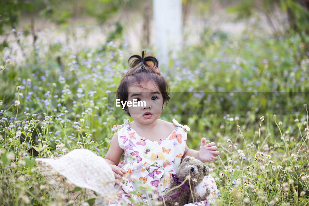 Portrait of cute girl in field