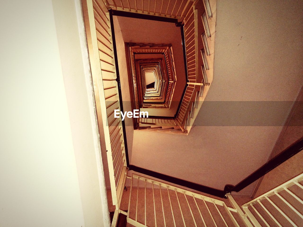 DIRECTLY BELOW SHOT OF SPIRAL STAIRCASE