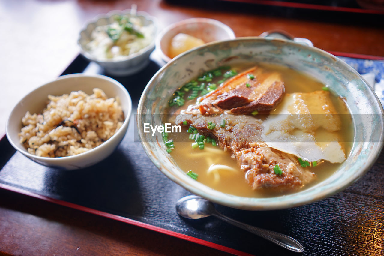 food and drink, food, healthy eating, bowl, asian food, meal, dish, wellbeing, soup, meat, table, no people, freshness, cuisine, japanese food, indoors, vegetable, culture, stew, seafood, rice - food staple, plate, restaurant, crockery, lunch, city, high angle view, pasta, chopsticks, tradition