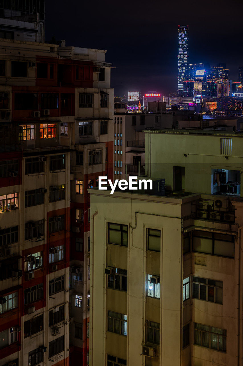 Illuminated buildings in city at night