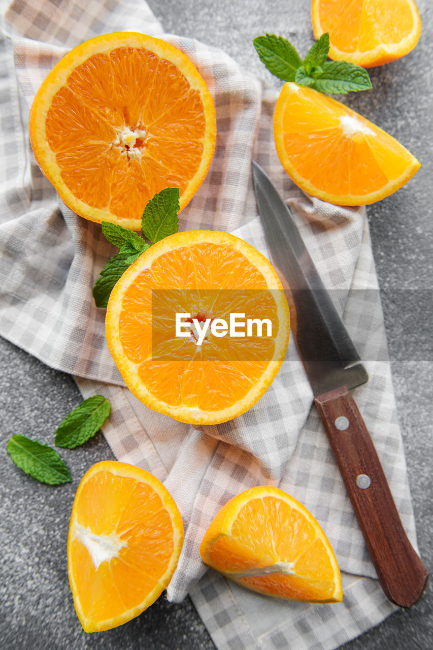 Fresh ripe oranges on dark concrete background