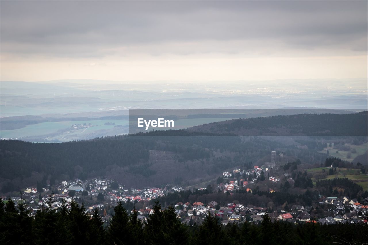 Scenic view of landscape against cloudy sky