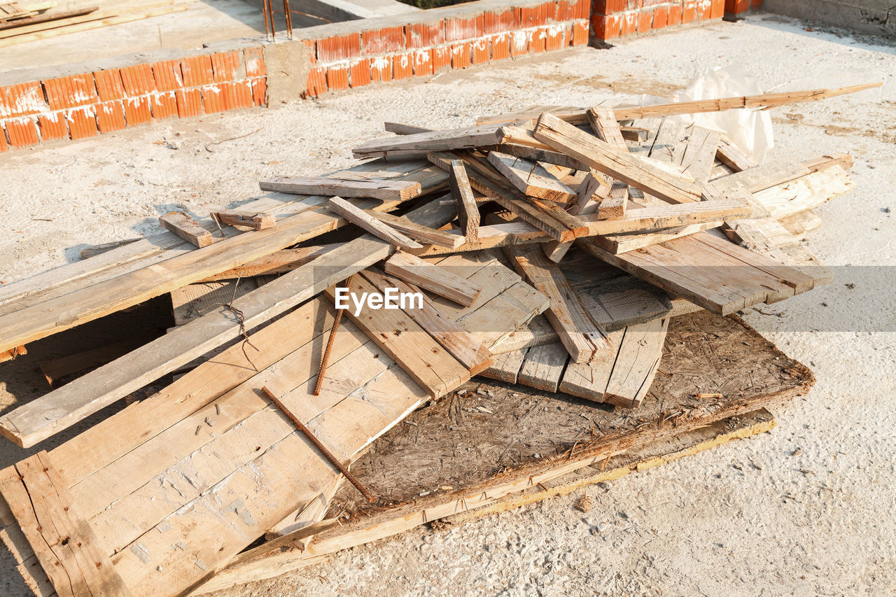 HIGH ANGLE VIEW OF STACK OF FIREWOOD