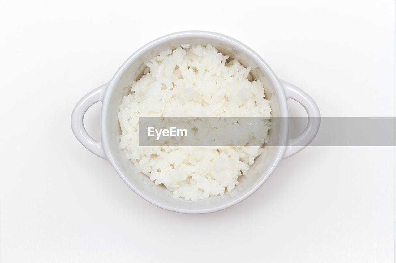 Close-up of rice served on white background