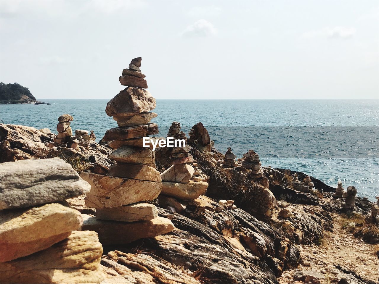 STACK OF ROCKS ON SHORE