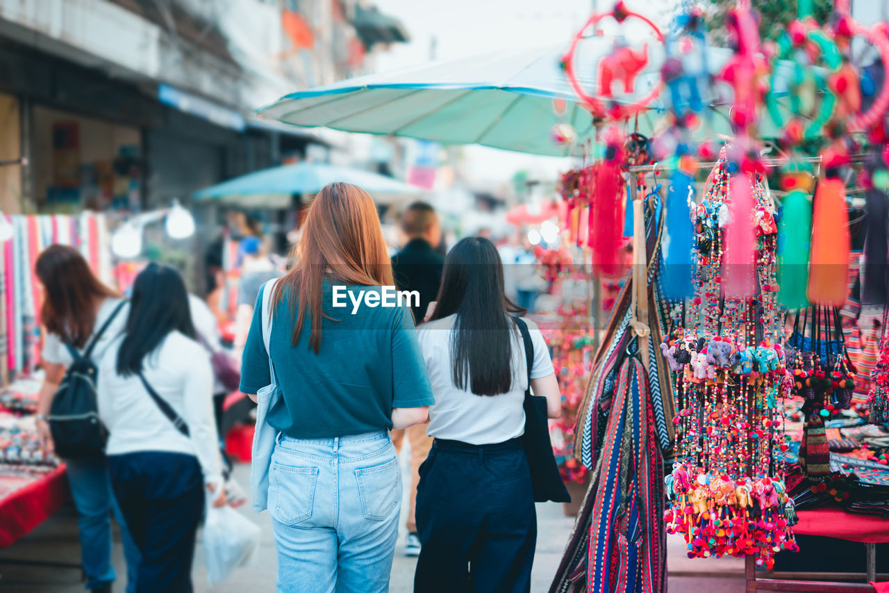 Asian woman travel and shopping at thailand night market