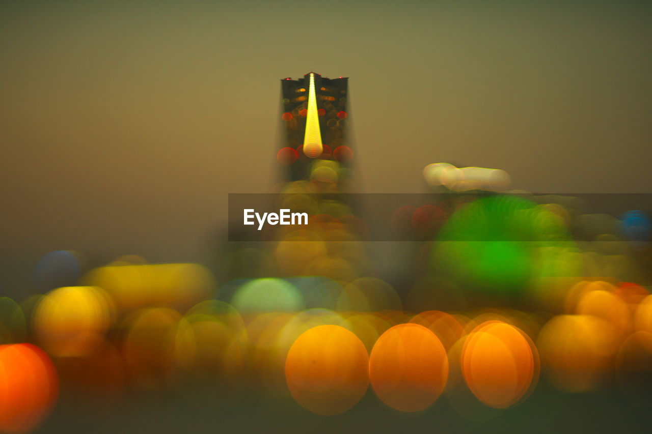 Defocused image of illuminated yokohama landmark tower at night