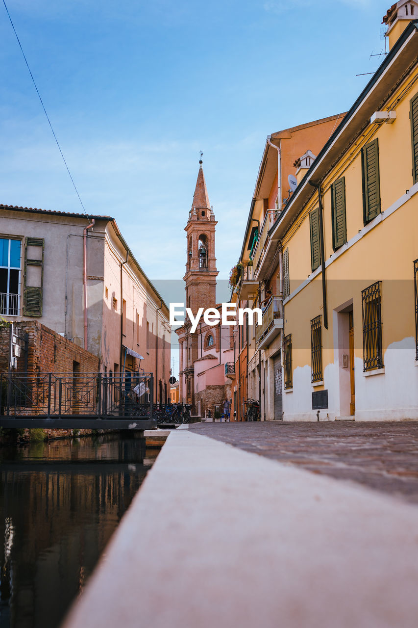 View of the historic center of comacchio with its main canal, blue sky