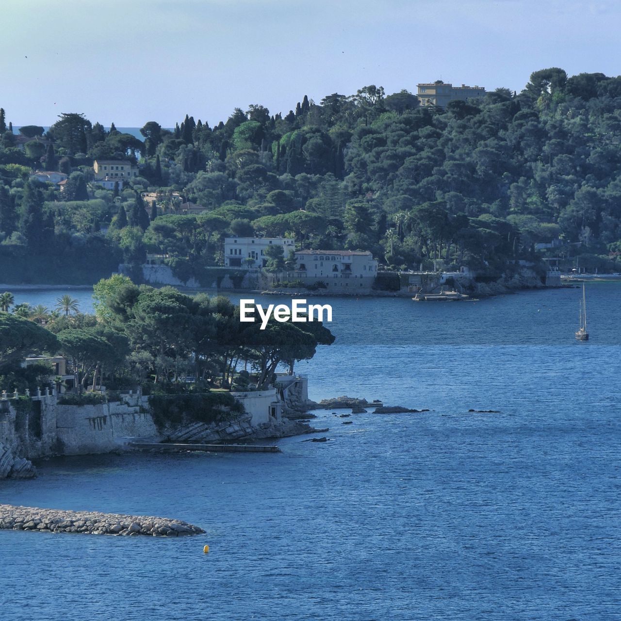 Scenic view of harbor against sky