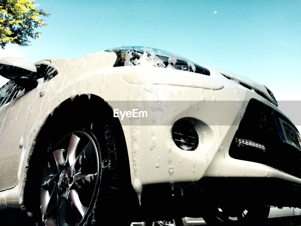 Low angle view of car being washed