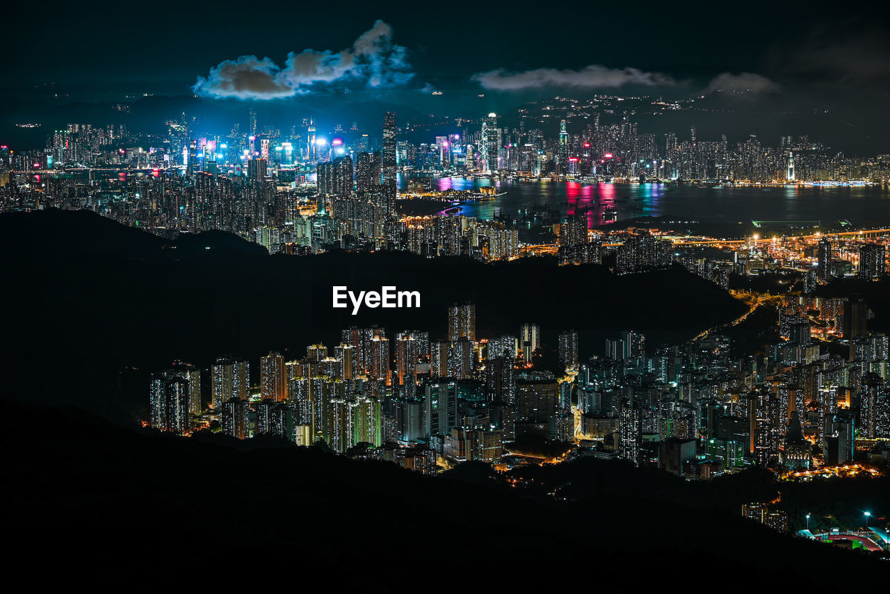 High angle view of illuminated buildings in city at night