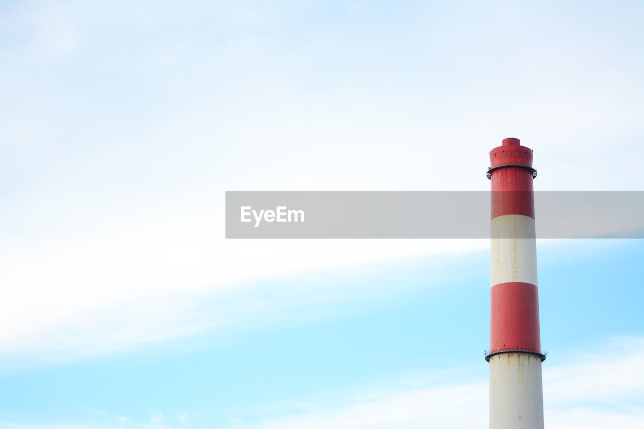 LOW ANGLE VIEW OF FACTORY AGAINST SKY