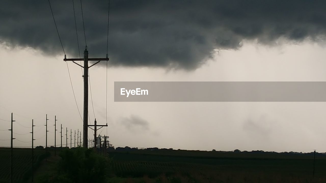 ELECTRICITY PYLONS ON FIELD