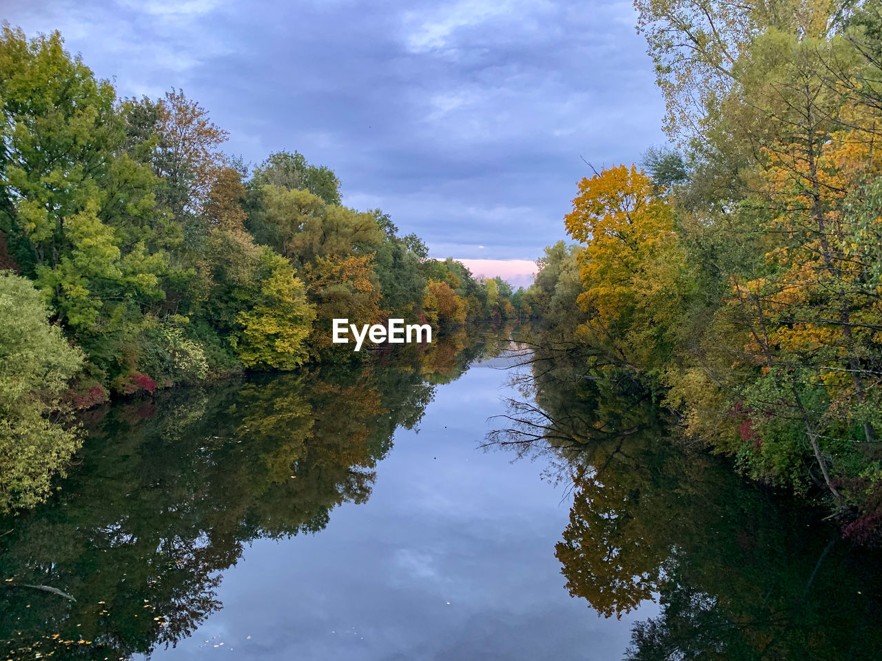 Reflection of trees in lake against sky during autumn