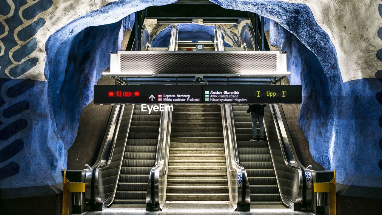 HIGH ANGLE VIEW OF ESCALATOR ON SUBWAY STATION