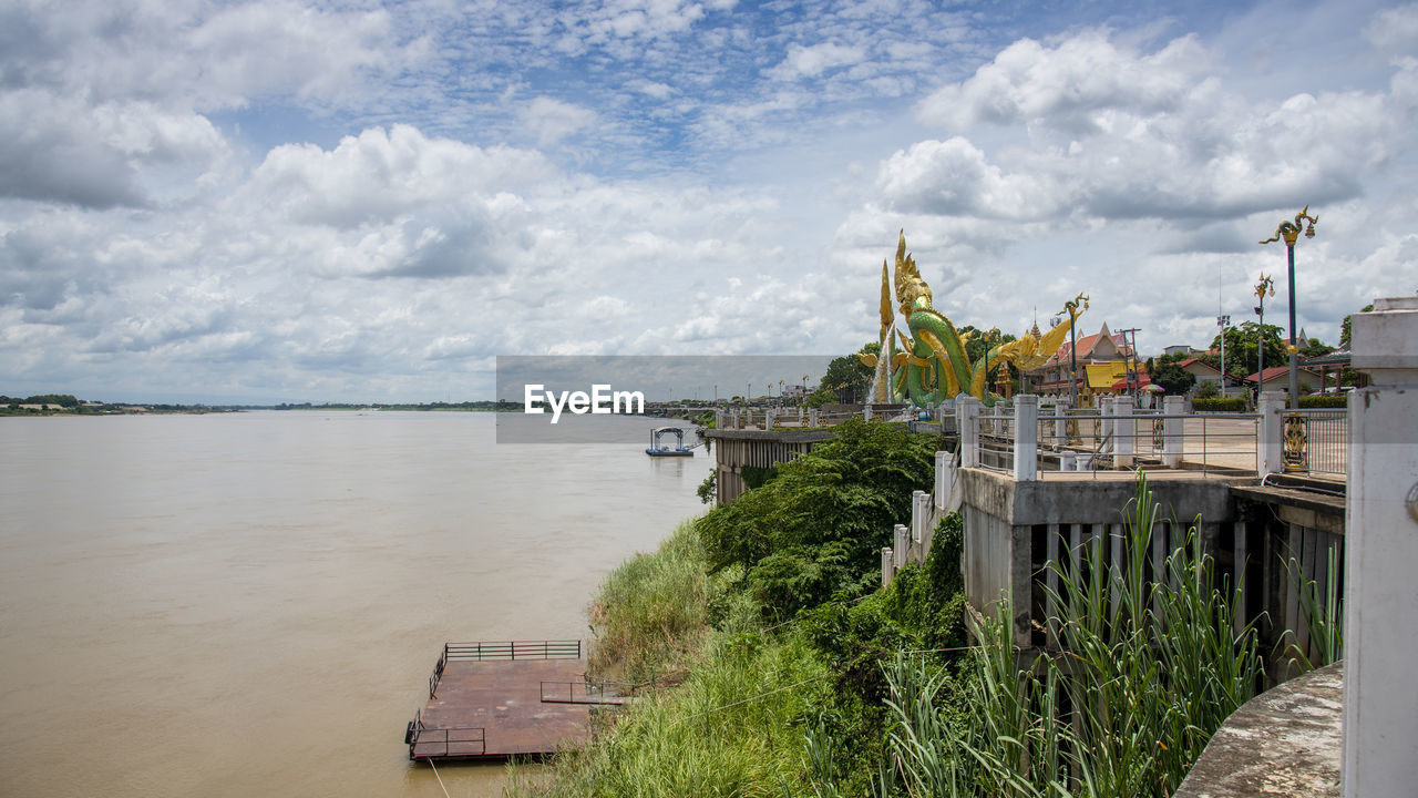 SCENIC VIEW OF LAKE AGAINST BUILDING