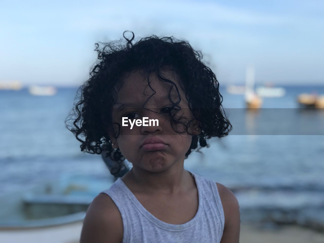 Girl with curly hair at beach