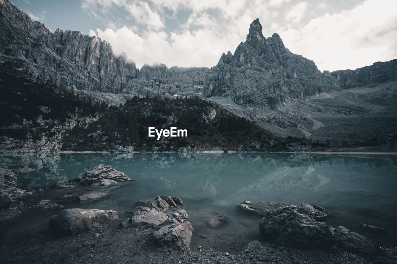 Scenic view of lake and mountains against sky