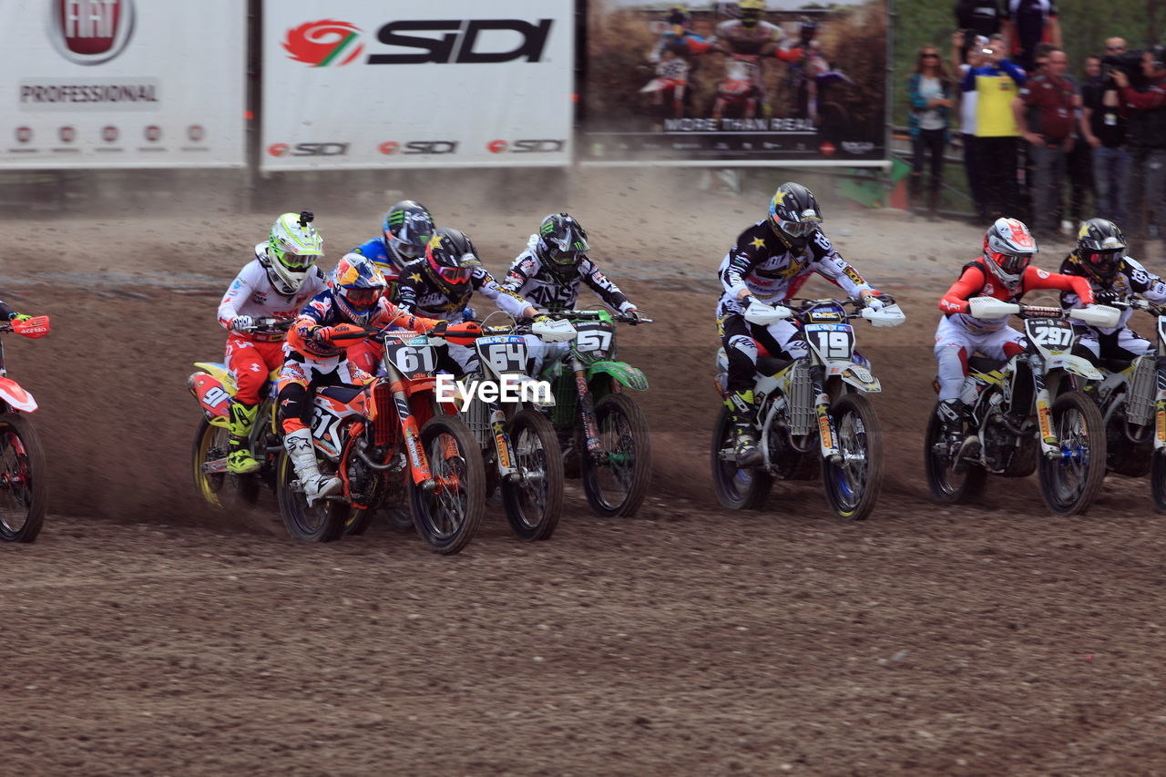Motocross racers on dirt track