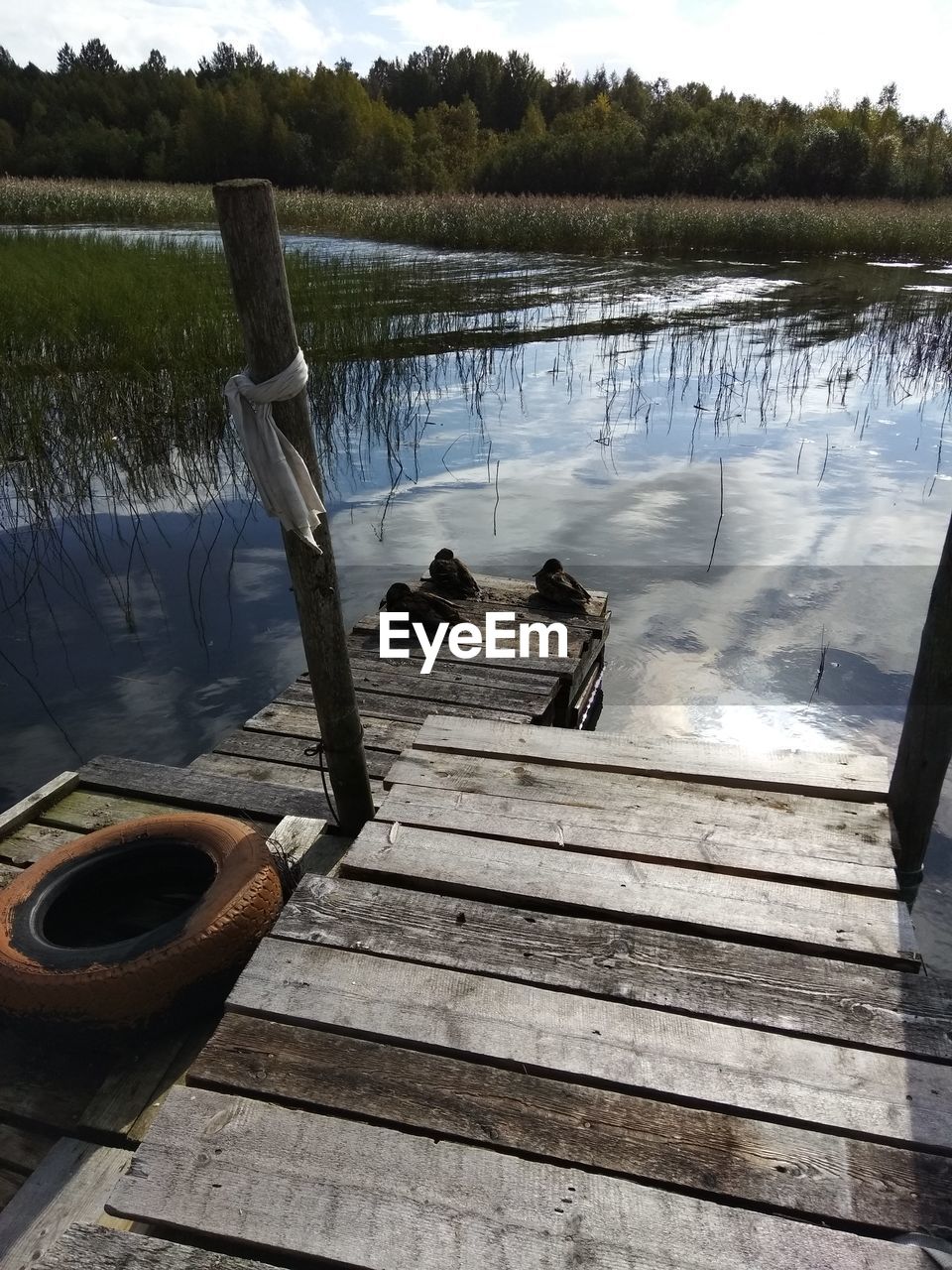 WOODEN PIER OVER LAKE