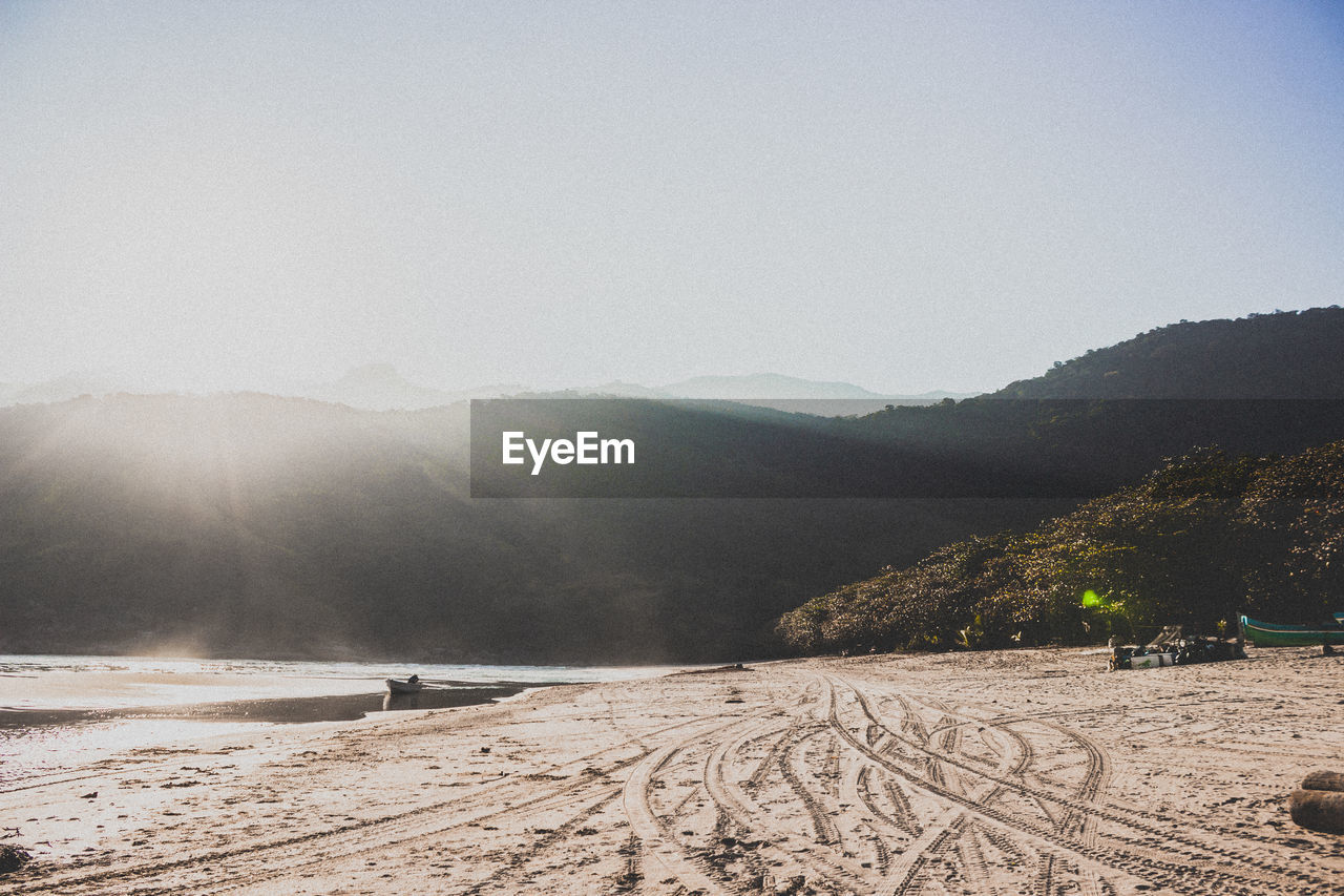 Scenic view of beach against clear sky