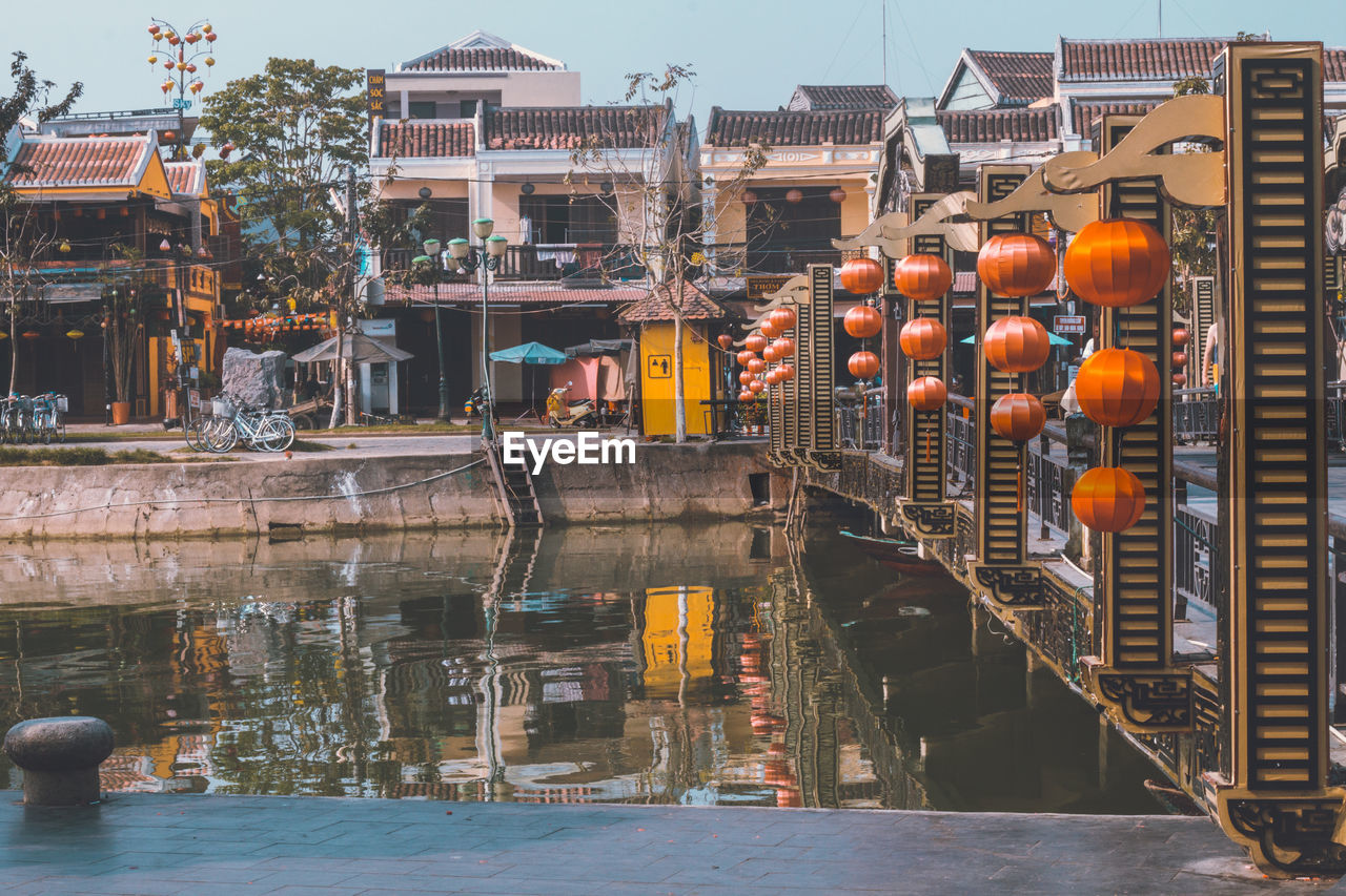 REFLECTION OF BUILDINGS ON RIVER