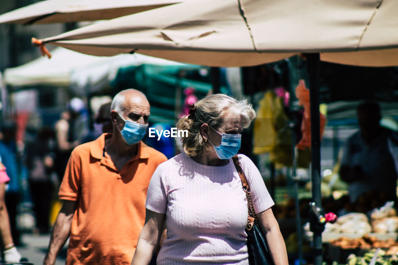 PEOPLE STANDING OUTDOORS